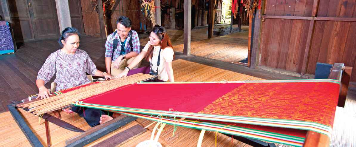 weaving fine bamboo strips at Sarawak Cultural Village