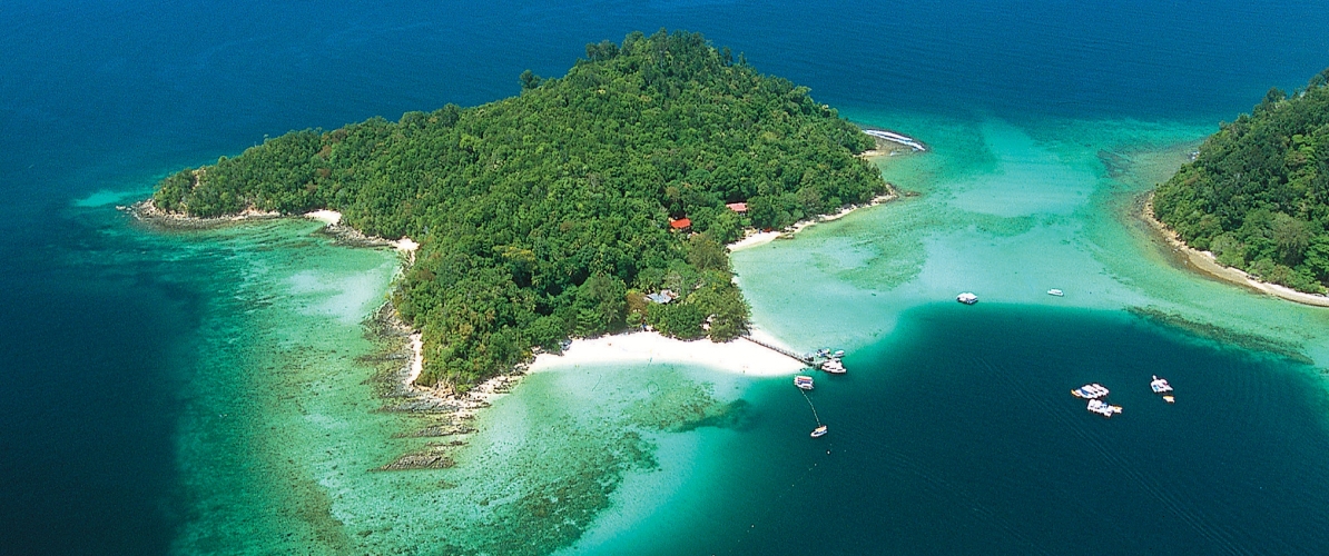 Aerial view of a tropical island in Tunku Abdul Rahman Park and Pulau Tiga