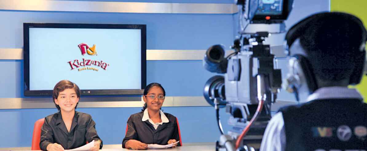 newscaster role playing while in Kidzania Kuala Lumpur